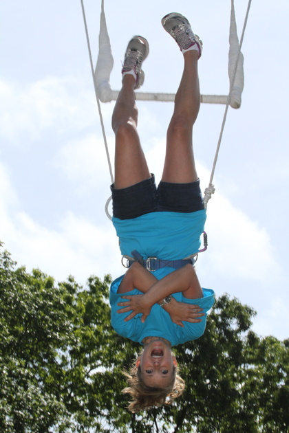 A Skyline Mom enjoys the trapeze in circus class at Mother/Daughter Weekend!